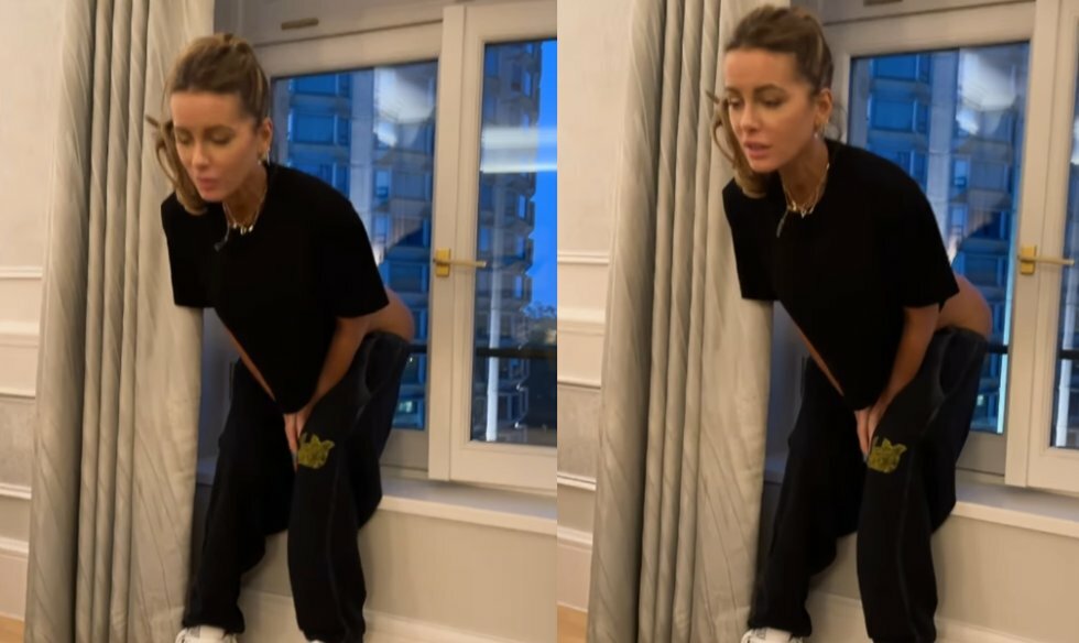 Kate Beckinsale mooner folk på gaden i London fra sit hotelværelse
