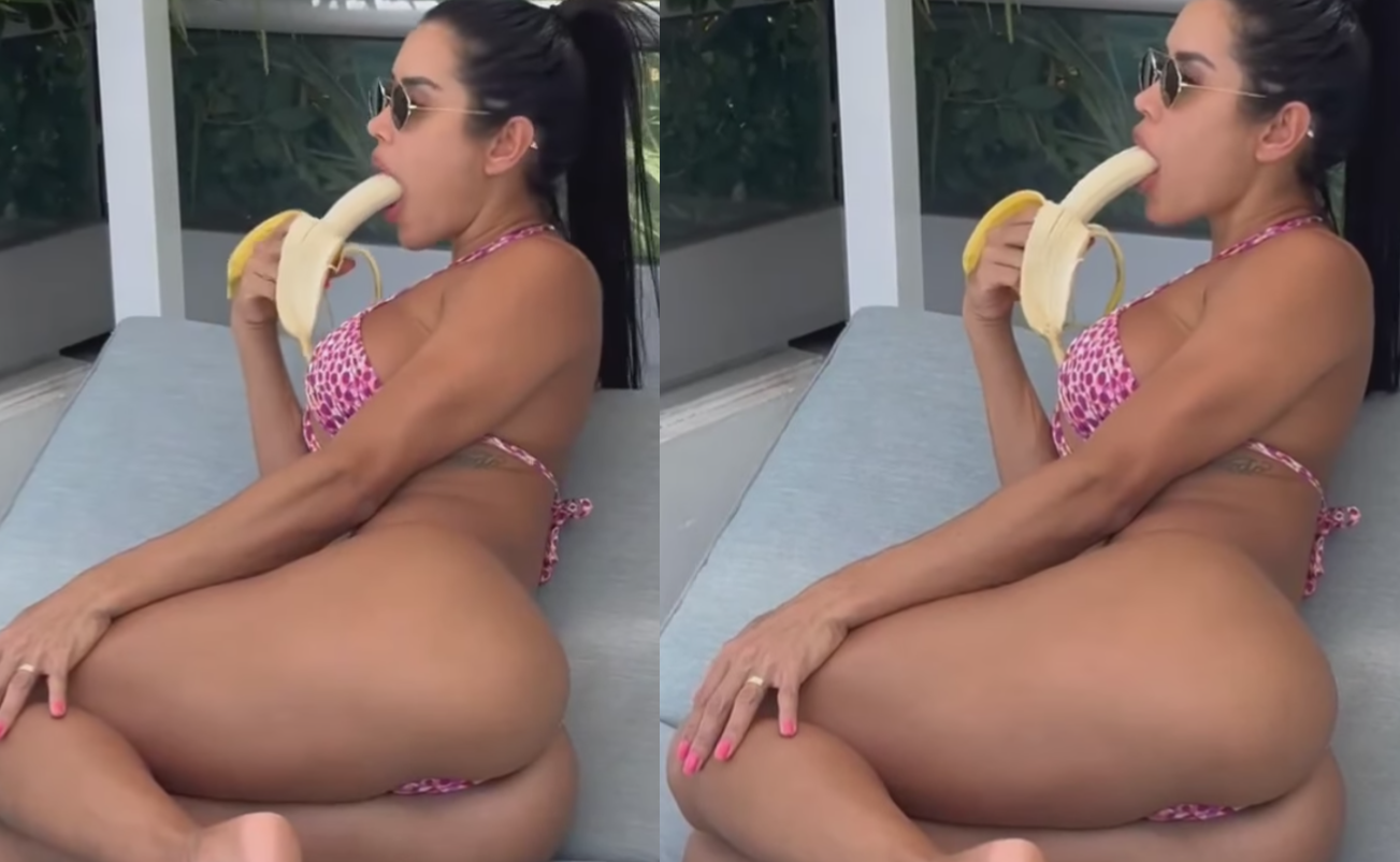 Bikini-kvindes alternative måde at spise banan stjæler opmærksomheden ved poolen